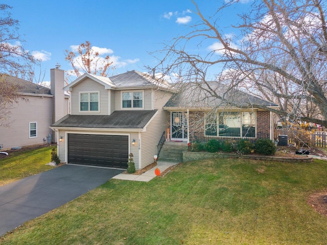 view of front facade with a garage and a front yard