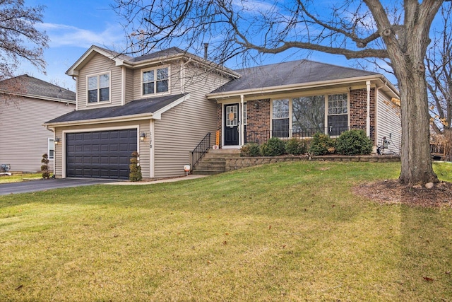 view of front facade with a garage and a front lawn