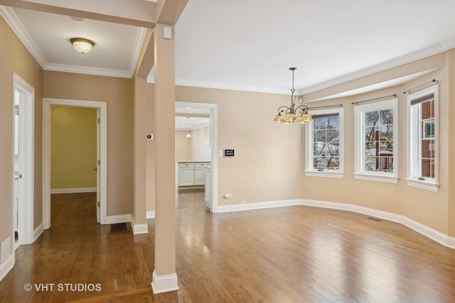 interior space with an inviting chandelier, crown molding, and dark hardwood / wood-style floors