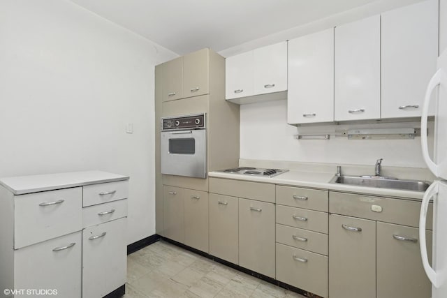 kitchen with sink and white appliances