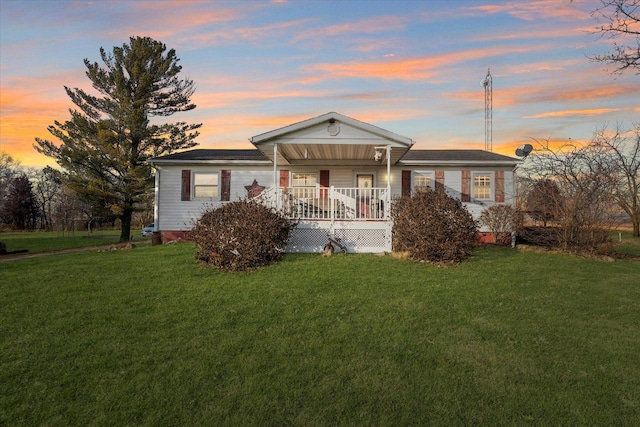 view of front of home featuring a yard and covered porch