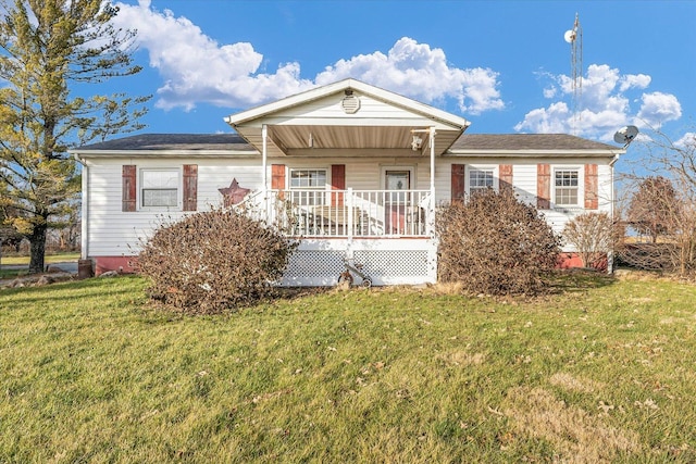 view of front of house with covered porch and a front yard