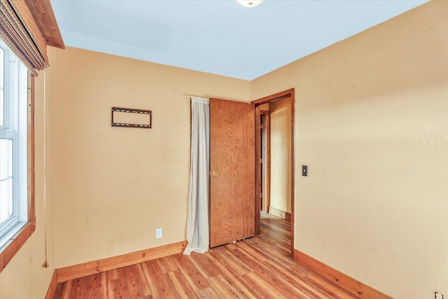 unfurnished room featuring light hardwood / wood-style floors