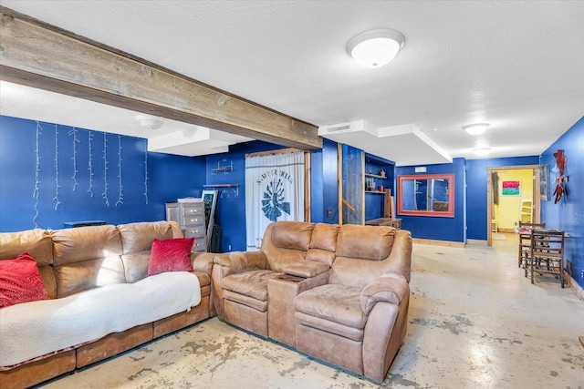 living room with beamed ceiling and a textured ceiling