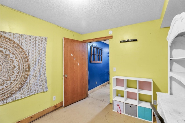 interior space featuring a textured ceiling