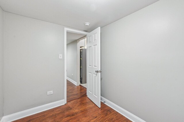 spare room featuring dark hardwood / wood-style floors