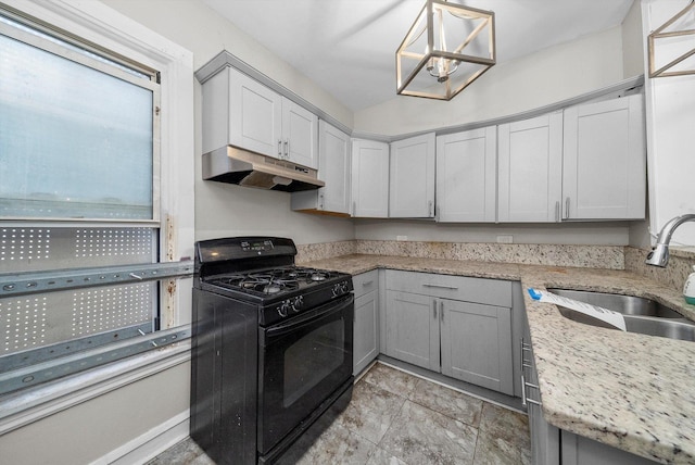 kitchen with gray cabinets, sink, black range with gas cooktop, and hanging light fixtures