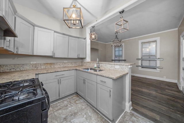 kitchen with wall chimney range hood, sink, hanging light fixtures, kitchen peninsula, and black range with gas cooktop