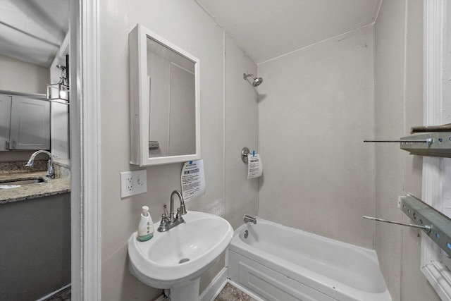 bathroom with shower / bathtub combination and sink