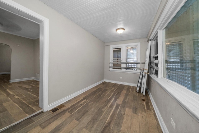 hall with dark hardwood / wood-style floors