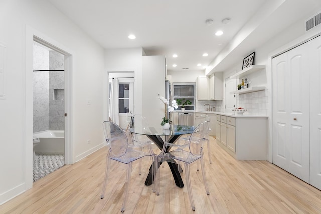 dining space featuring light hardwood / wood-style floors