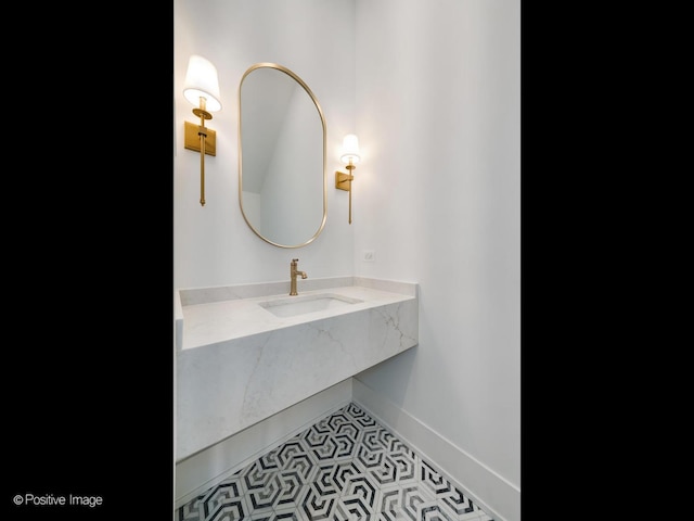 bathroom featuring tile patterned flooring and sink