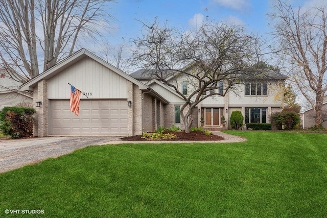 view of front of home with a garage, brick siding, driveway, and a front lawn