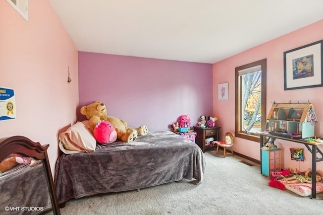 carpeted bedroom with baseboards