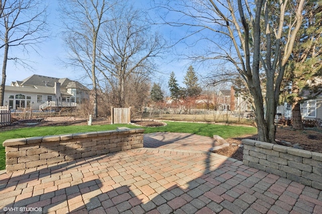 view of patio featuring fence