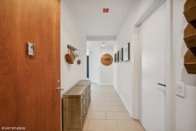 hallway with light tile patterned floors