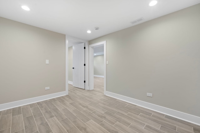 unfurnished room featuring light hardwood / wood-style flooring