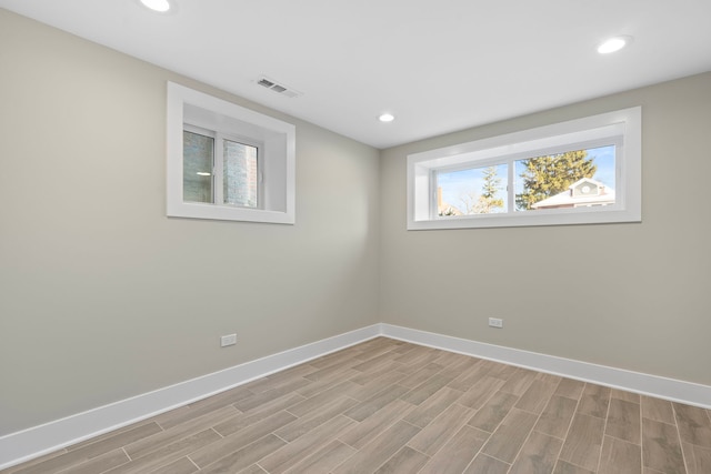 empty room with light hardwood / wood-style floors