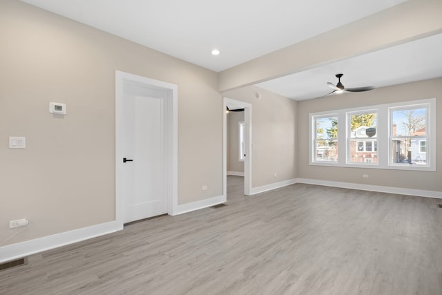 unfurnished room with ceiling fan and light hardwood / wood-style flooring