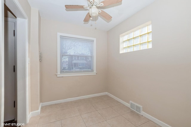 unfurnished room featuring ceiling fan and light tile patterned floors