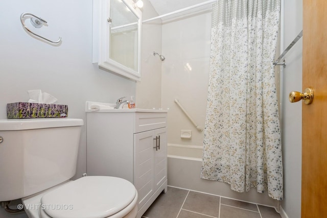 full bathroom featuring tile patterned flooring, vanity, toilet, and shower / bath combo with shower curtain