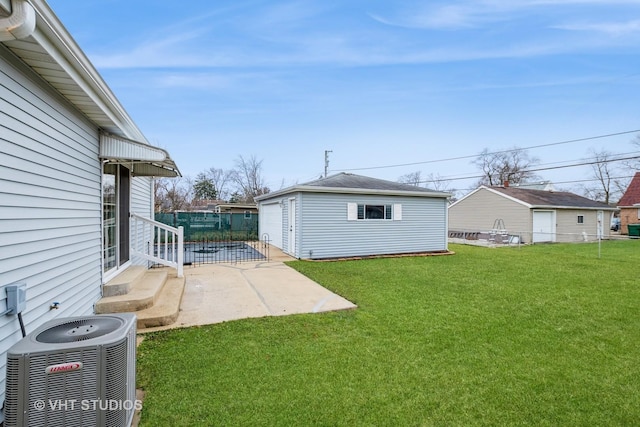 view of yard featuring an outbuilding and cooling unit