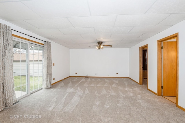 spare room featuring ceiling fan and light carpet