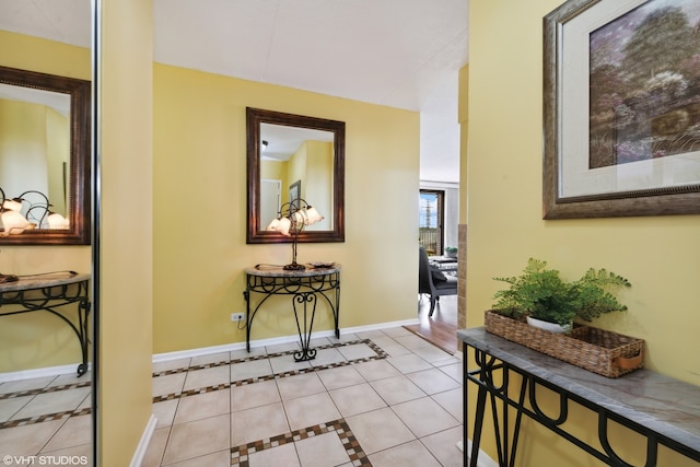 hall featuring light tile patterned floors