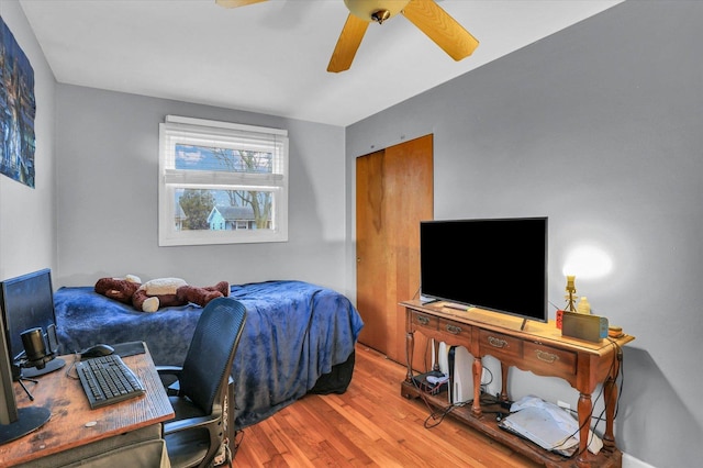 bedroom with hardwood / wood-style floors and ceiling fan