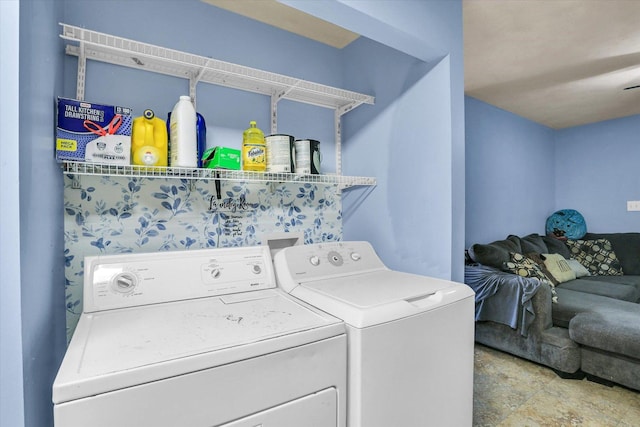 laundry area with washing machine and clothes dryer