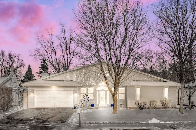 ranch-style home with a garage