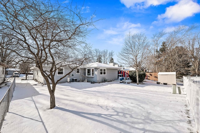 view of front of property with a shed