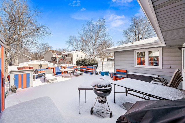 view of snow covered patio