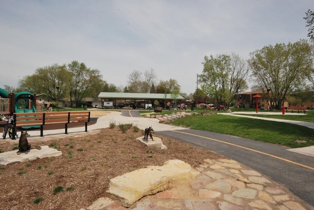 view of community with a playground and a lawn