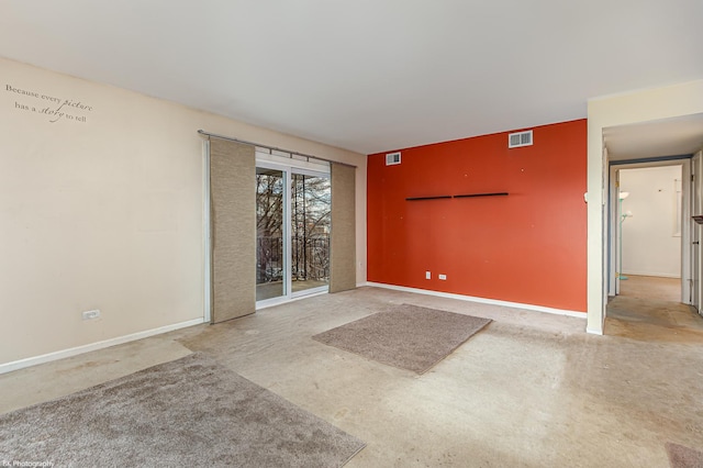 spare room featuring concrete floors