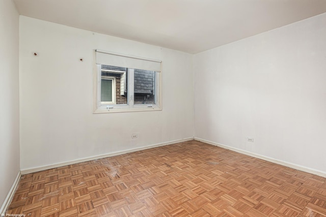 spare room with light parquet flooring