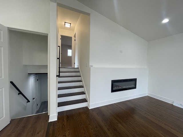 staircase with hardwood / wood-style flooring