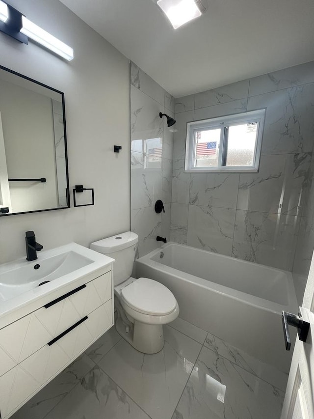 full bathroom featuring toilet, vanity, and tiled shower / bath