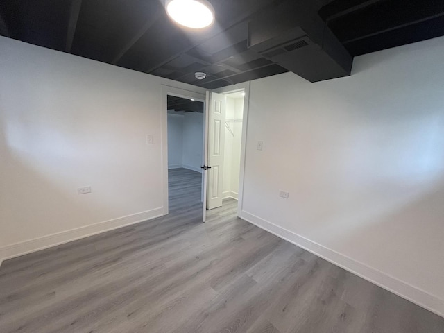 basement featuring wood-type flooring