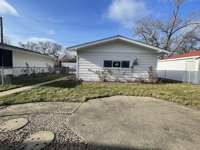 rear view of house with a yard and a patio