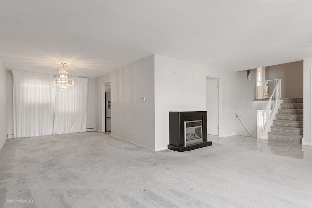 unfurnished living room featuring light carpet and a chandelier