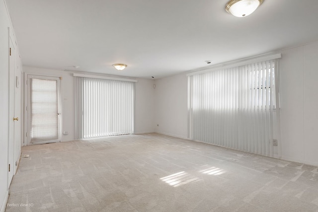 empty room featuring light colored carpet