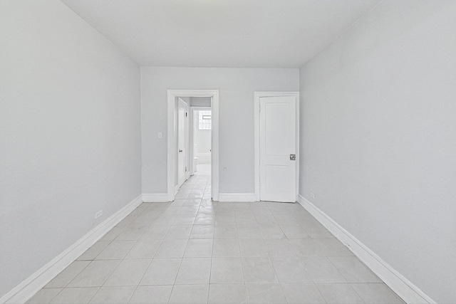 spare room with light tile patterned floors