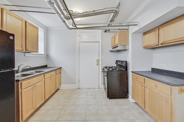 kitchen featuring light brown cabinetry, sink, light tile patterned floors, and black appliances