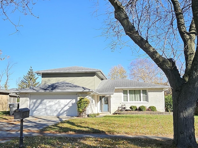 view of front of home with a garage and a front yard