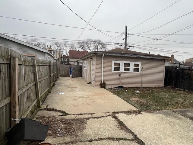 view of property exterior with a patio area