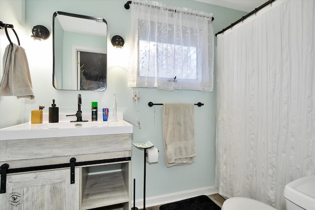 bathroom featuring vanity and toilet