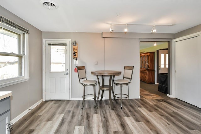 dining room featuring wood-type flooring