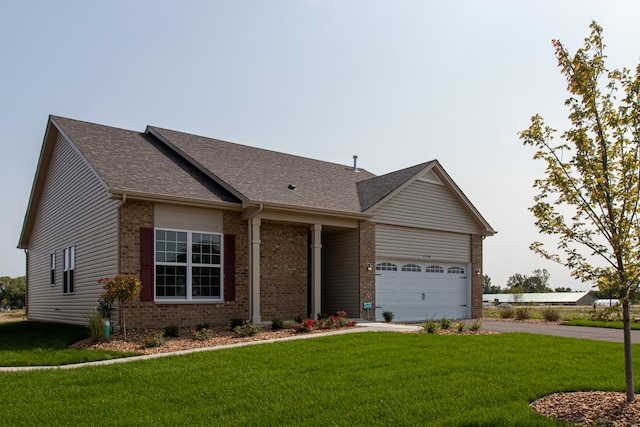 ranch-style home featuring a front yard and a garage