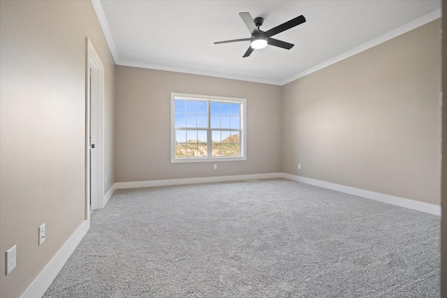 unfurnished room with ceiling fan, baseboards, crown molding, and light colored carpet